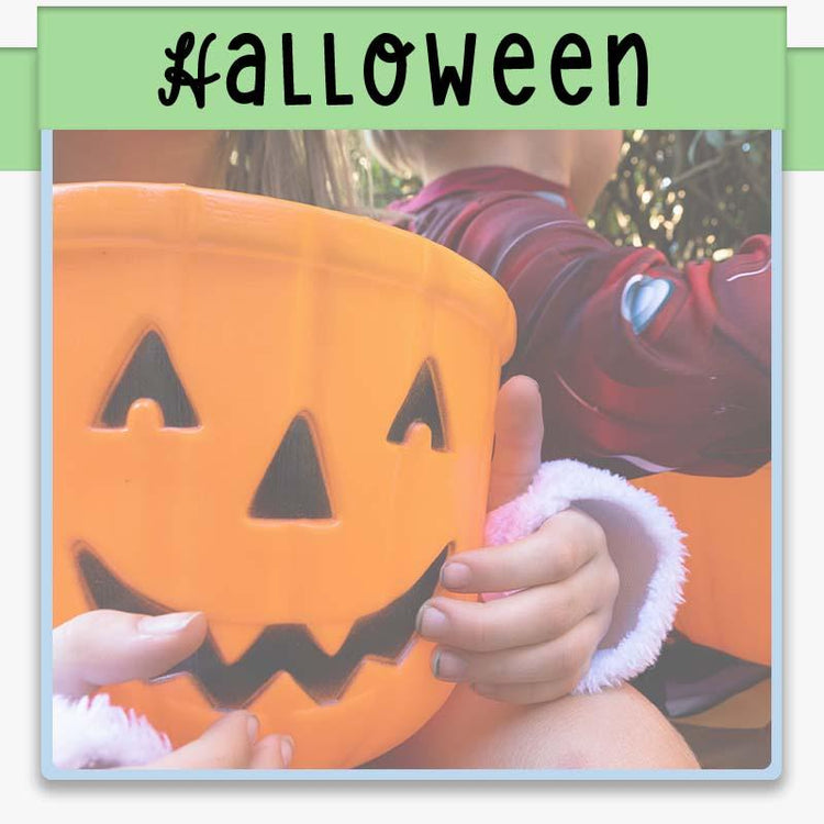 child holding a jack o lantern candy bucket for halloween